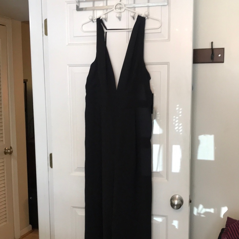 Amazing black open back jumpsuit WITH POCKETS from Lulus. New with tags!